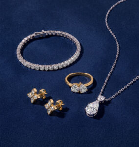 Bestselling diamond jewelry pieces from Rare Carat, displayed on a blue background